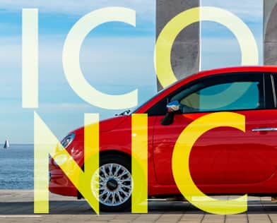 The word "Iconic" in yellow over a red 2018 Fiat 500.
