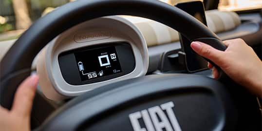 The steering wheel and Digital Cluster Display in the Fiat Topolino.